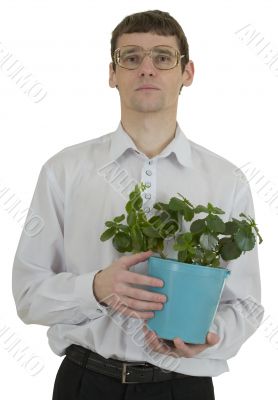 Man in spectacles with window plant