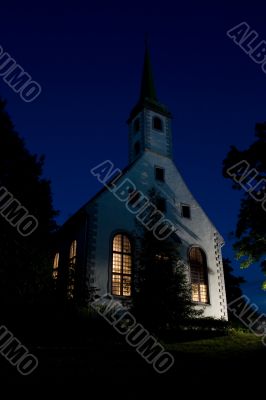 Small white church in evening