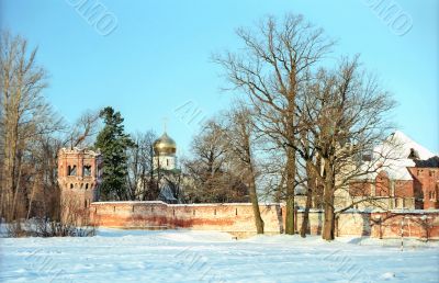 Red fortress wall and a church