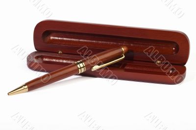 Mahogany ball point pen lying on its case