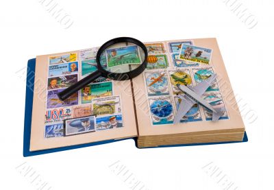 Album of aviation stamps, aircraft & magnifier