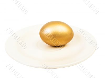 golden egg at plate