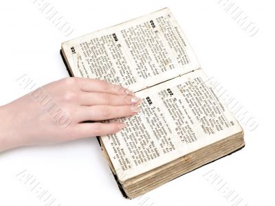 woman hand on old book