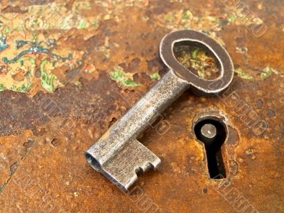 rusty keyhole with key