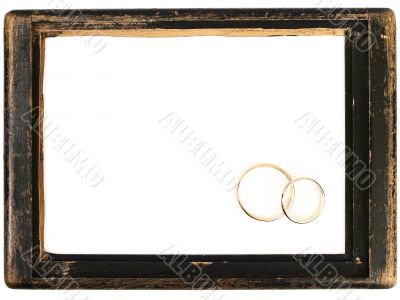 vintage wooden frame and wedding rings