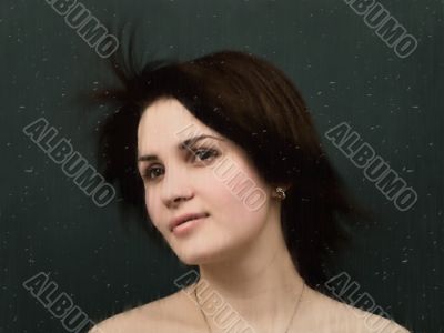 woman behind wet glass