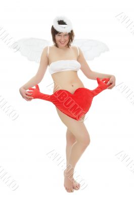 Young woman in angel`s costume with red heart