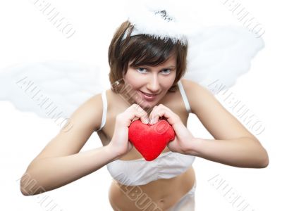 Young woman in angel`s costume with red heart