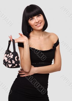 Smiling young woman with handbag