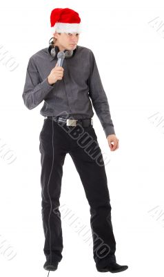 man wearing Santa hat, with  microphone.