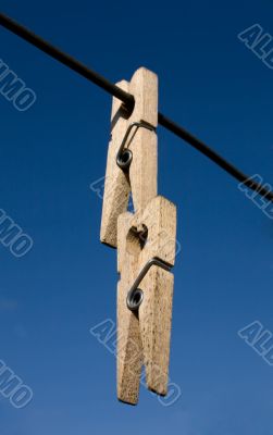 Two wooden clothes-peg