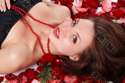 woman on rose petals
