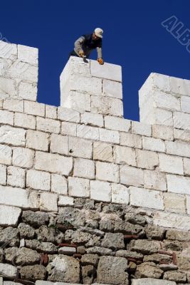 Worker on the stone wall