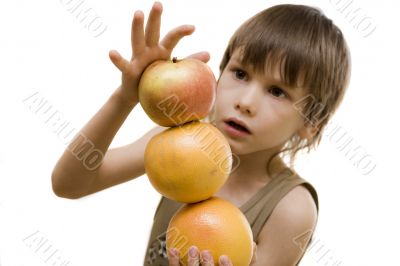 Fruit pyramid in boy`s hand