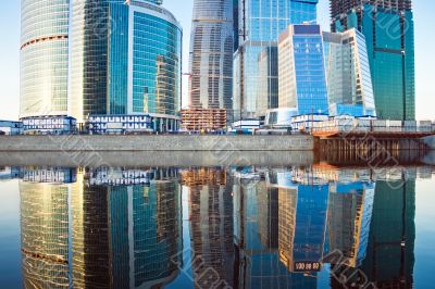 Skyscrapers at sunset and reflection