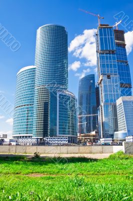 New skyscrapesrs and green grass