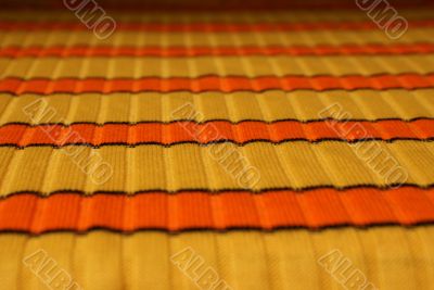 Yellow-orange horizontal striped cloth background