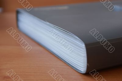 Grey folder on the wooden table