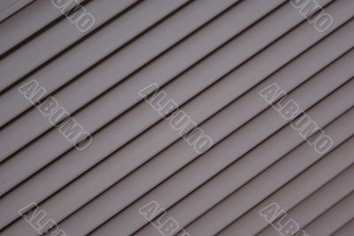 Grey striped diagonal background like a jalousie