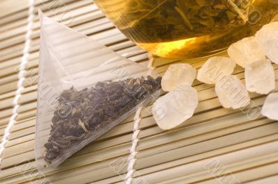 white tea, nylon tea-bag and sugar