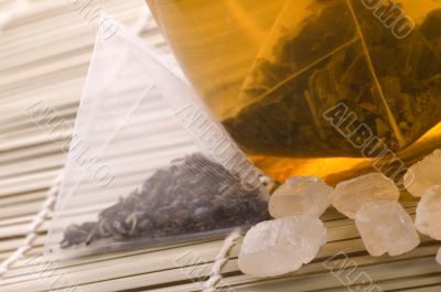 white tea, nylon tea-bag and sugar