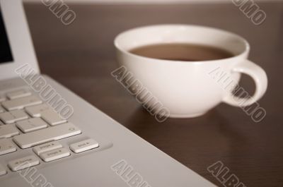 laptop and tea cup