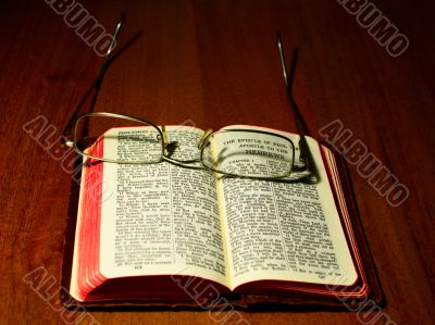 The Bible book on a table.