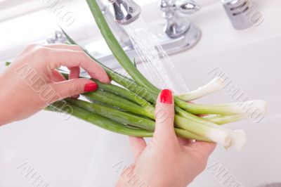 Woman Washing Onions