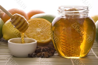 fresh honey with honeycomb, spices and fruits