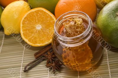 fresh honey with honeycomb, spices and fruits