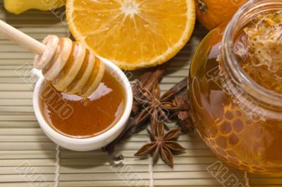 fresh honey with honeycomb, spices and fruits