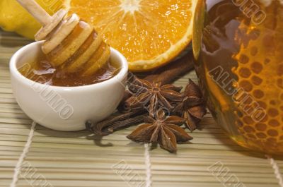 fresh honey with honeycomb, spices and fruits