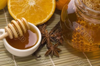fresh honey with honeycomb, spices and fruits