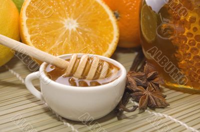 fresh honey with honeycomb, spices and fruits