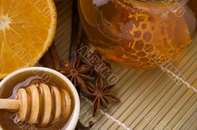 fresh honey with honeycomb, spices and fruits