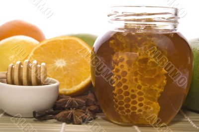 fresh honey with honeycomb, spices and fruits