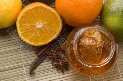 fresh honey with honeycomb, spices and fruits