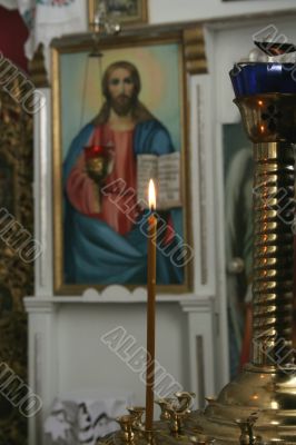 Candle before an icon