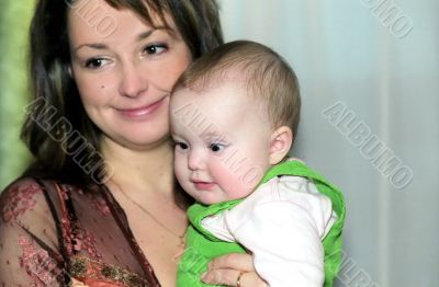 Mother takes her child in arms