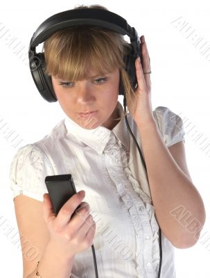 Girl look on player and listening music