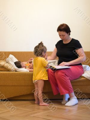 Two children with mom