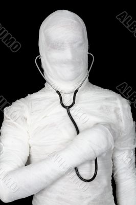 Man in costume mummy with stethoscope