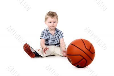 Child plays basketball