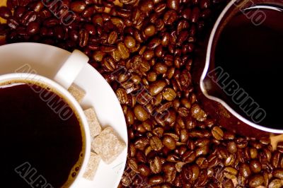 coffee, caffee-maker over beans background