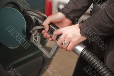 Woman Pumping Gasoline