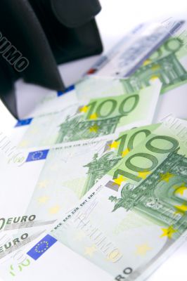 euro and a leather purse