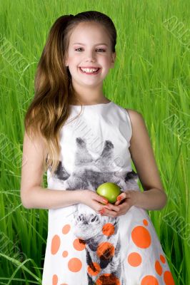 With my apple in the grass