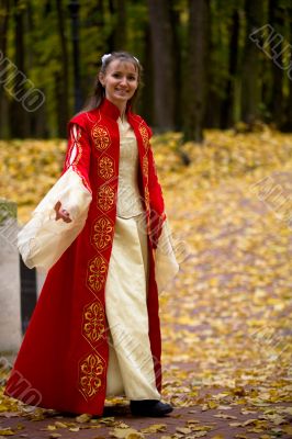 Lady in autumn forest