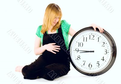 pregnant woman with a clock