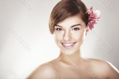 happy young woman with orchid